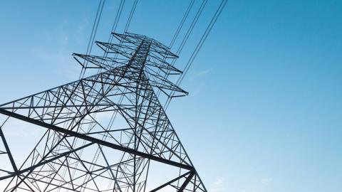 Electricity transmission power lines at sunset (High voltage tower)