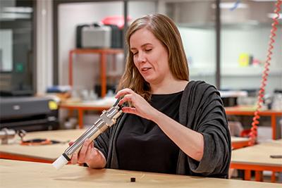 Irene Zakrzewski, R&D Manager at Vaisala, with the MGP241 in hand