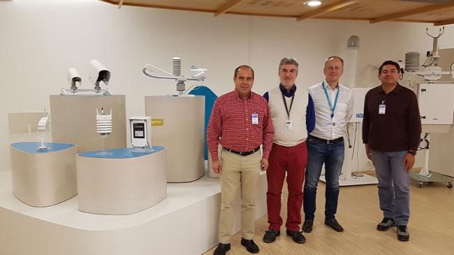 Men standing next to Vaisala aviation products